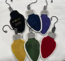 Load image into Gallery viewer, Six wool applique ornaments with metal ornament hooks in the shape of vintage light bulbs made for Christmas 2023.
