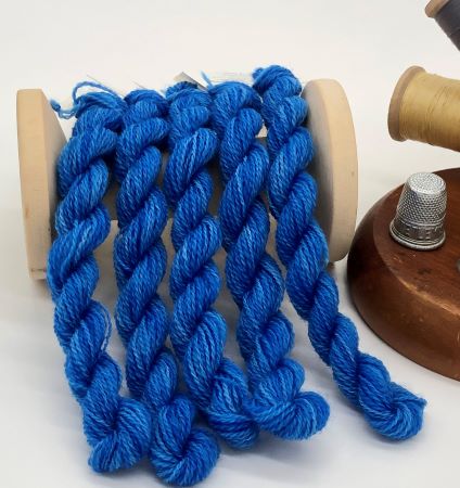 Five skeings of hand dyed wool thread in a medium dark, variegated blues., perfect for wool applique.