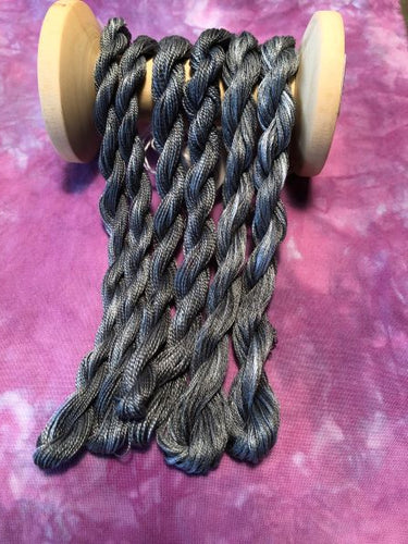 Hand dyed threads in #12 and #8 pearl cotton and 6 strand embroidery floss in variegated black