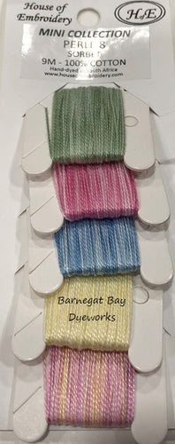 Five colors of hand dyed variegated threads - greens, pinks, blues, yellows and purple/pink/peach.