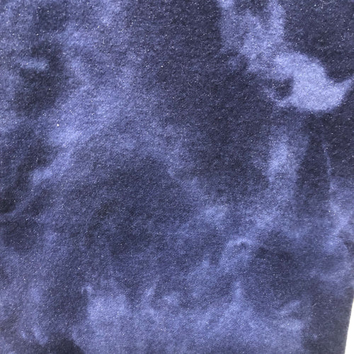 Hand Dyed mottled blue fabric with coloring from light to dark blue with a metallic thread running through it to make it sparkle.