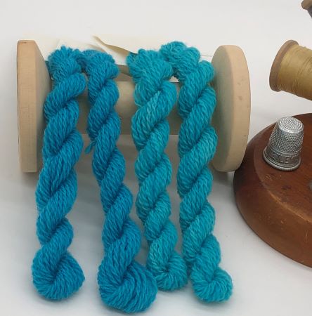 Two shades of  Seabreeze hand dyed wool threads are a bright turquoise for wool applique and crewel work.