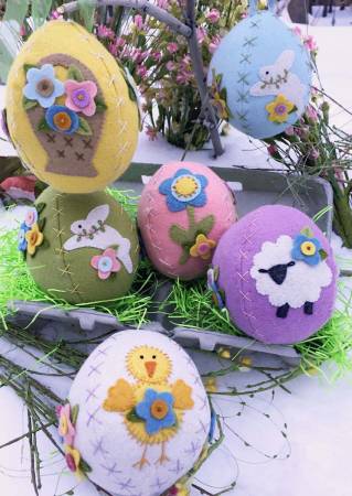 Pattern for five sweet and easy Easter eggs made with wool or wool felt with a sheep, basket, rabbit, chick and flowers to wool applique.