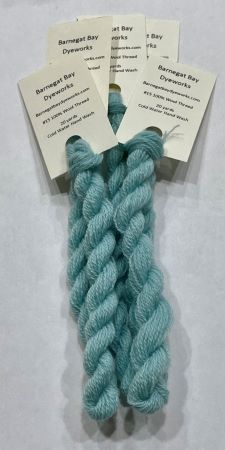 A light colored blue green hand dyed #15 wool thread.
