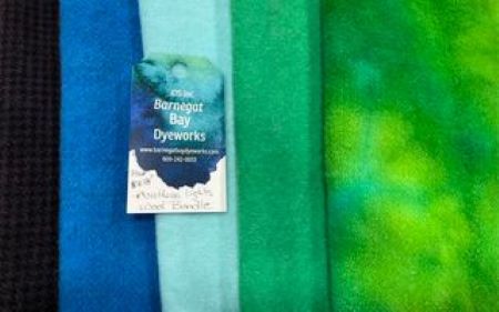 Hand dyed wool in colors of the Northern Lights sky - black, two blues and two greens.