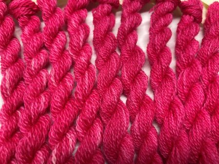 Hand dyed wool threads in a slightly variegated dark pink - available in two sizes #15 and #8 skeins.