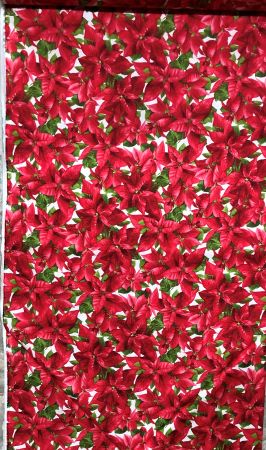 All over red Poinsettia with green leaves cotton fabric