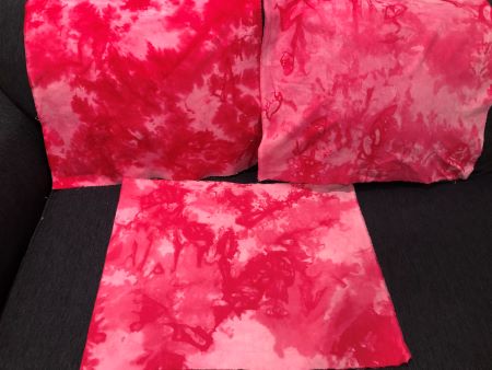 Red and Pink hand dyed mottled fabrics in cotton, flannel and linen