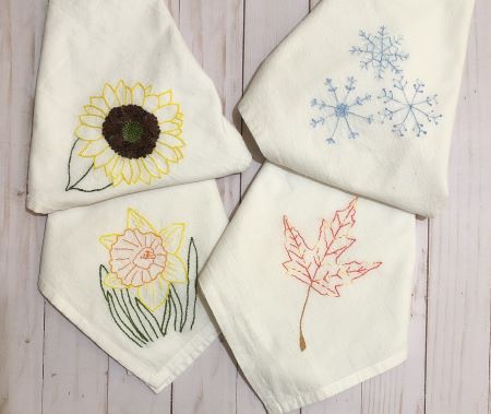 Four seasonal hand embroidery towels - Spring Daffodil, Summer Sunflower, Fall Maple Leaf and Winter Snowflakes pattern & kits.