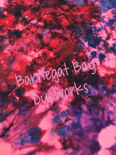 Tie dyed look with red, pink, purple and blue on 100% wool fabric