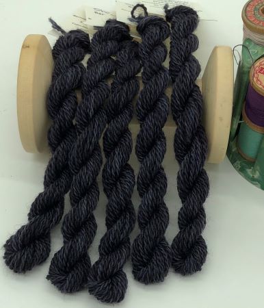 Hand dyed #8 wool thread is a medium dark black with tiny bits of gray - think stormy skies, shadows, shading dark objects and more for wool applique, crewel work or any hand embroidery.