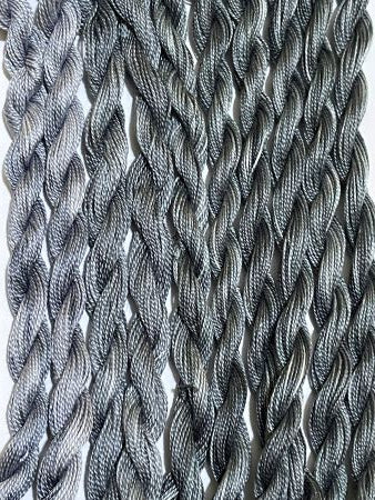 Hand dyed black and grays #12 pearl cotton threads.
