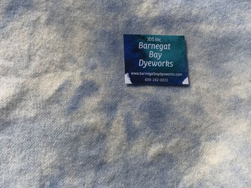 Highly mottled spot dyed sky blue on 100% wool white