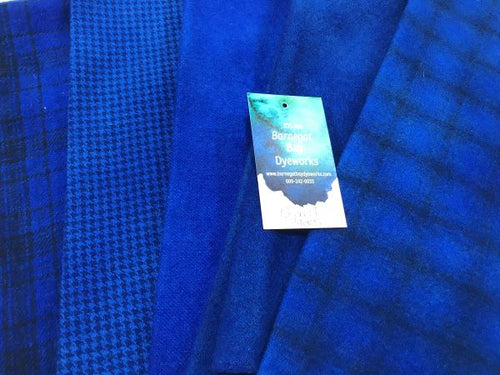 Five pieces of hand dyed wool in a deep, bright blue - cobalt blue