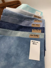 Load image into Gallery viewer, All of our hand dyed blue cotton fabrics for color comparison as of April 2022.
