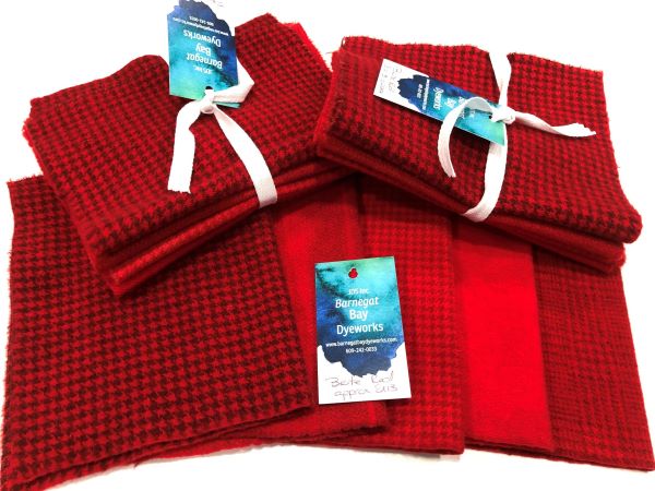 Five pieces of hand dyed Bright Red wool in one solid and four textures wools.