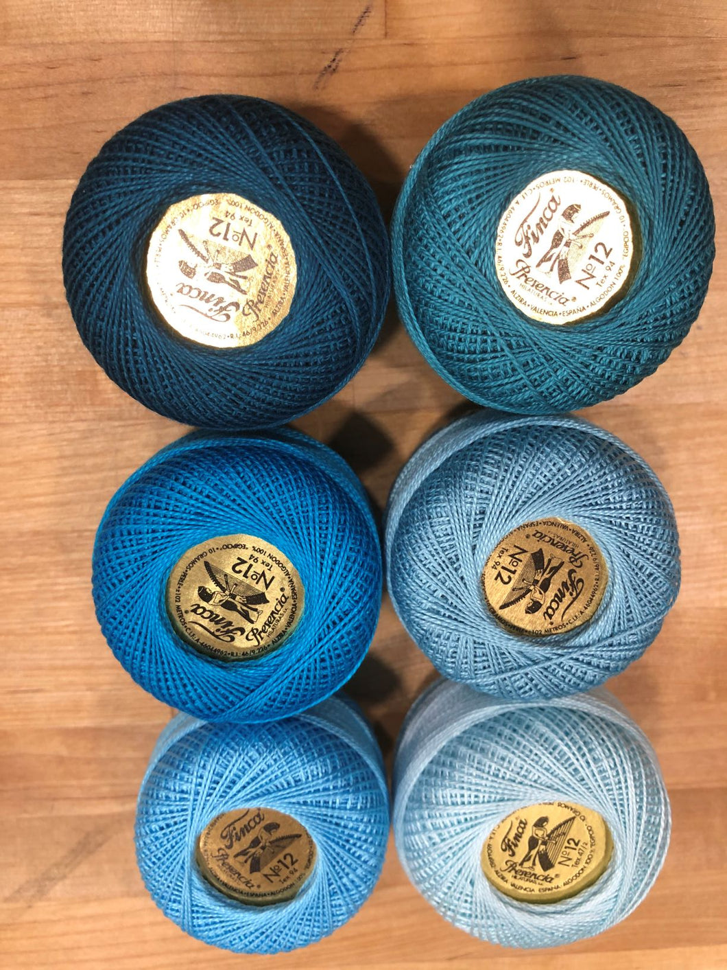 Finca Perle Cotton #12 Caribbean Collection in six balls of teals and green blues.