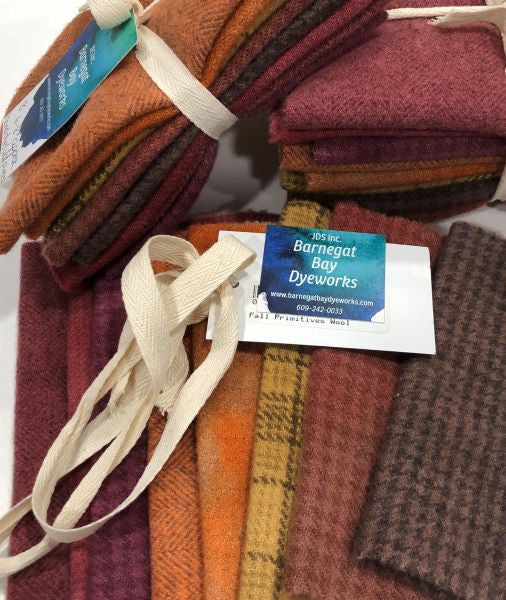 Eight piece hand dyed wool bundle includes three reds, two of each brown, orange and a gold in a primitive colorway.