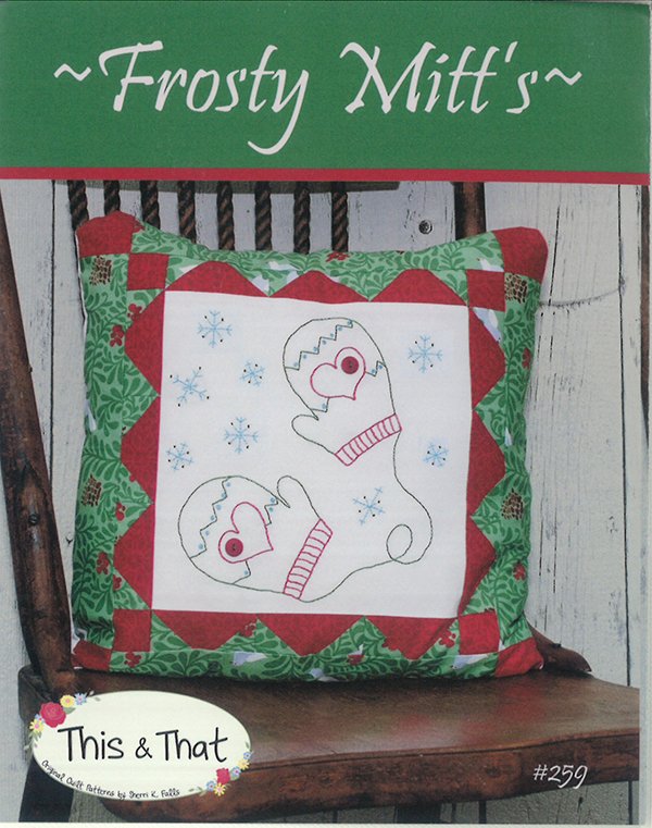 Pattern cover Frosty Mitt's by This & That with a center panel to hand embroider with a pair of mittens attached by a string and snowflakes and pieced border.