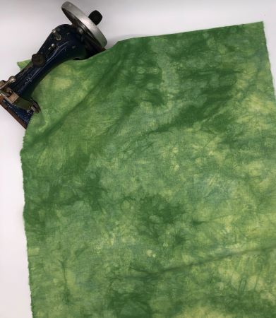 Grass Green Hand Dyed Linen with light to dark mottling and some touches of yellow.