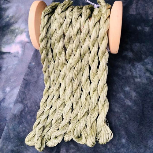  Hand dyed skeins of #12 and #8 pearl cottons and 6 strand embroidery floss in a light olive green.