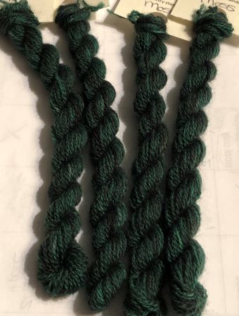 Skiens of hand dyed wooll thread  in greens from medium to dark.