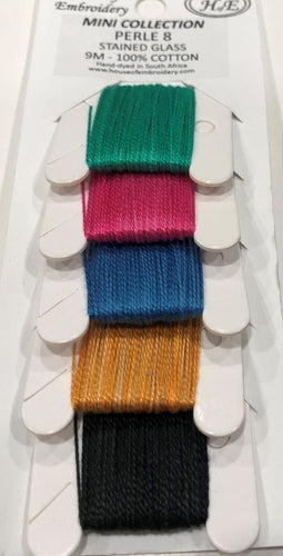 Five House of Embroidery hand dyed, slightly variegated #8 Perle Cottons in greens, pinky reds, blues, golds and black