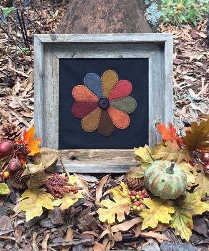 Pattern for a Dresden plate wool applique wall hanging in Fall colors.