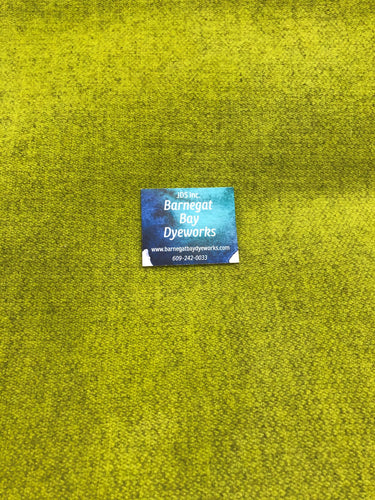 A bright yellow green dyed on a small textured 100% wool.