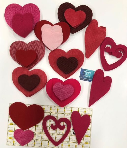 Wool die cut hearts in various shapes, colors and sizes.