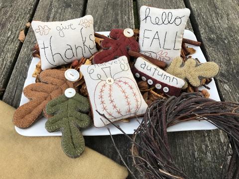 Four embroidered bowl fillers - Give Thanks, Hellow Fall, Autumn and Harvest with pumpkin - and three different sized leaves made from wool to decorate for Fall.