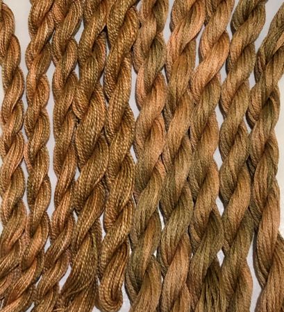 Hand dyed threads in a soft brown with a hint of orange in 6 strand cotton floss, #12 and #8 pearl cotton.