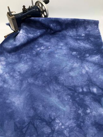 Mottled blue hand dyed linen with light and darks.