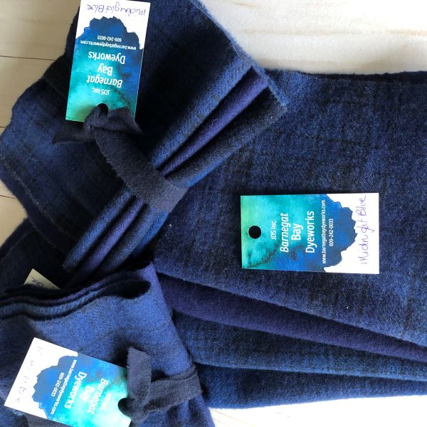 Four pieces of hand dyed wool in a medium dark blue, slightly lighter than our navy wool.