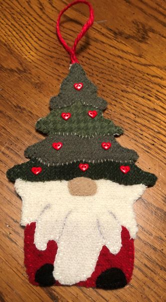Barnegat Bay Dyeworks' Oh, Christmas Gnome wool applique ornament sample. Gnome with a Christmas tree for his hat..