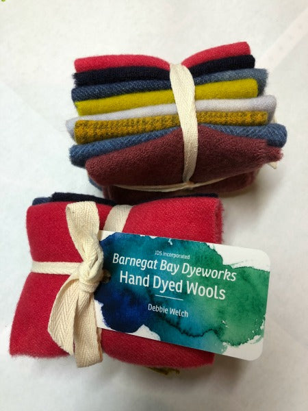 Eight patriotic hand dyed wool pieces in patriotic colors - two reds, three blues, two golds and a cream.