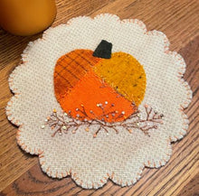 Load image into Gallery viewer, 8 inch wool applique mat has a crazy quilted pumpkin on a bittersweet vine.
