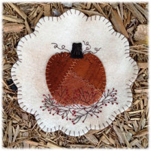 Load image into Gallery viewer, Pattern cover for an 8 inch wool applique mat has a crazy quilted pumpkin on a bittersweet vine.
