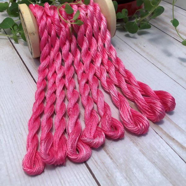Hand painted, #12 and #8 pearl cottons and 6 strand embroidery floss  in a variegated dark pink.