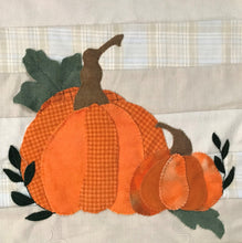 Load image into Gallery viewer, Close up of the two wool applique pumpkins on one end of our table runner sample.

