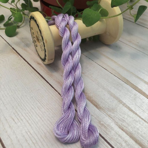 Skeins of hand dyed #8 Perle/Pearl Cotton.  Medium purple with subtle variegation, a red purple not a blue purple.