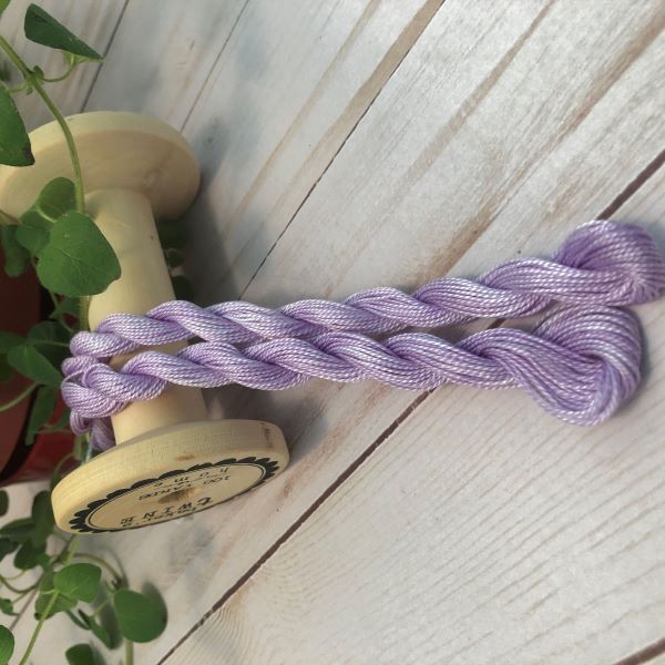 Skeins of hand dyed #8 Perle/Pearl Cotton.  Medium purple with subtle variegation, a red purple not a blue purple.