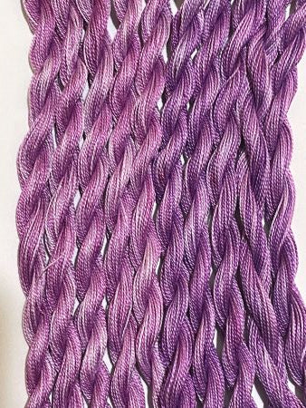 Two shades of purple variegated hand dyed #12 Pearl thread.