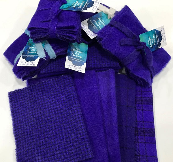 Five pieces of hand dyed wool in a deep rich blueish purple