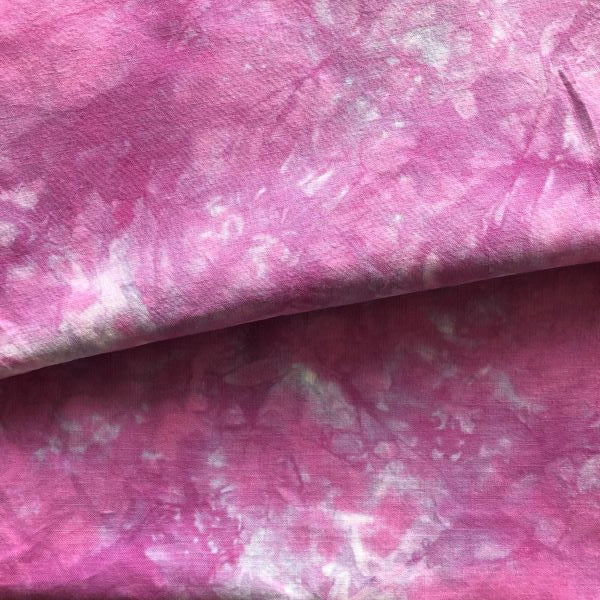 Hand Dyed Cotton Fabric in a mottled medium purple with some blue tones.