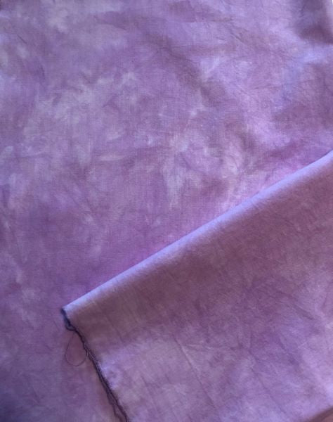 Cotton fabric hand dyed a mottled medium purple.