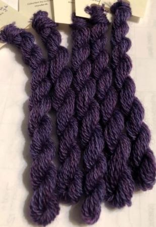 This hand dyed wool thread is a dark, variegated purple  - for  wool applique iris, pansies and more.