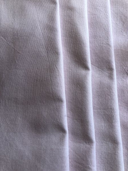 Hand dyed cotton fabric in a pale purple with slight mottling