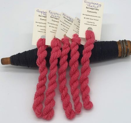 Hand Dyed Thread in a warm, dark pink.