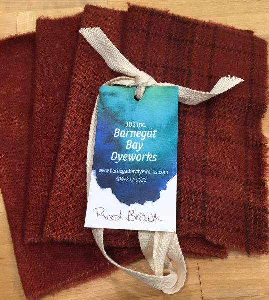 Four pieces of reddish brown hand dyed wool, two solids and two textures. This is more red than brown.